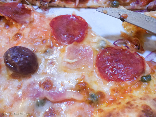 Pizza with olives and pepperoni