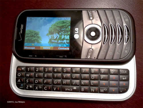 LG Cosmos 3 phone with keyboard showing