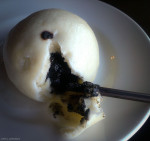 Black sesame bun showing filling